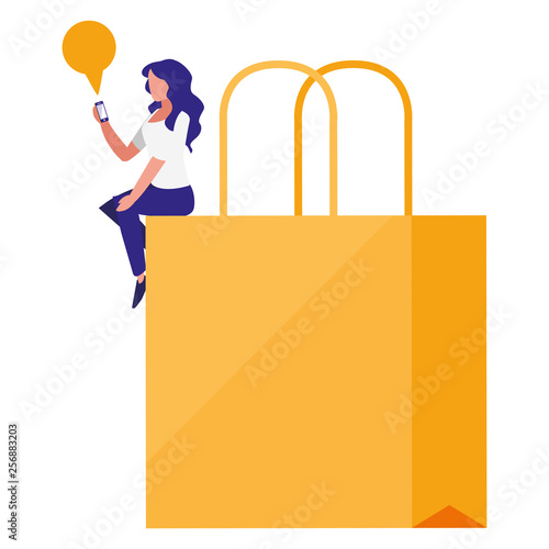 woman using smartphone with shopping bag