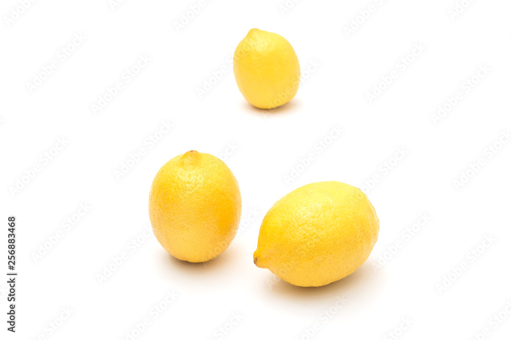 Ripe lemons on a white background, citrus fruits Ripe lemons on a white background, citrus fruits