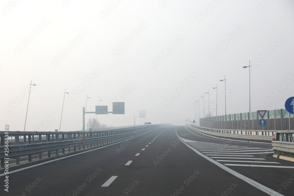 fog very dangerous for motorists on the highway junction in wint