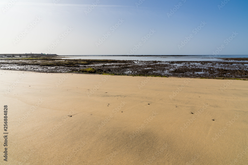 Spain, Lanzarote, White sand beach of arrecife in low water phase