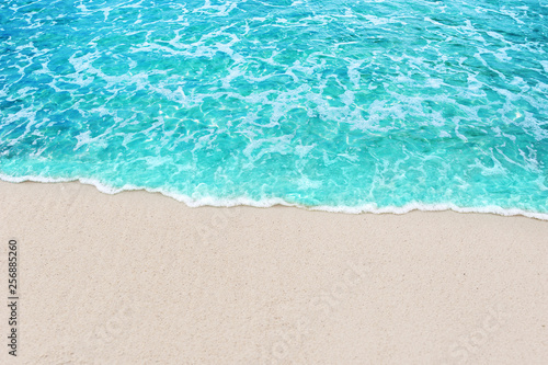 Soft blue ocean wave and water sea clear on white sandy beach