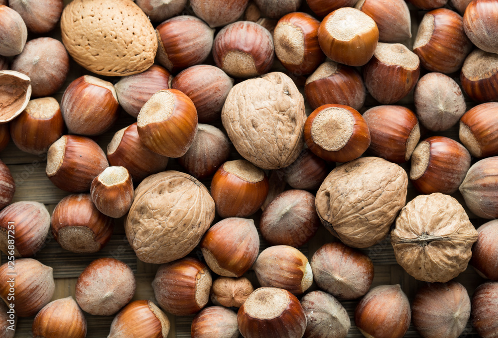 Scattered nut on table top view. Nut assortment flat lay. Nut texture. Nut package Scattered nut on table top view. Nut assortment flat lay. Nut texture. Nut package