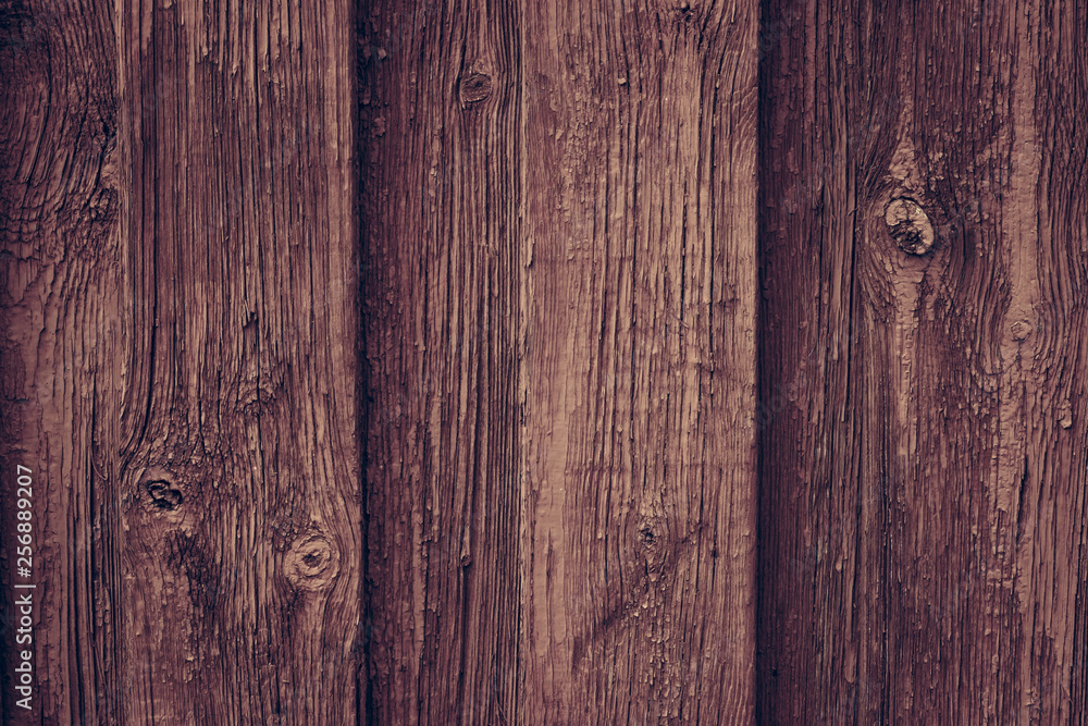 Fototapeta premium Brown wooden retro table. Red wooden wall background in rustic style. Old brown wall wood vintage floor. Wooden fence maroon painted. Wood brown boards texture.