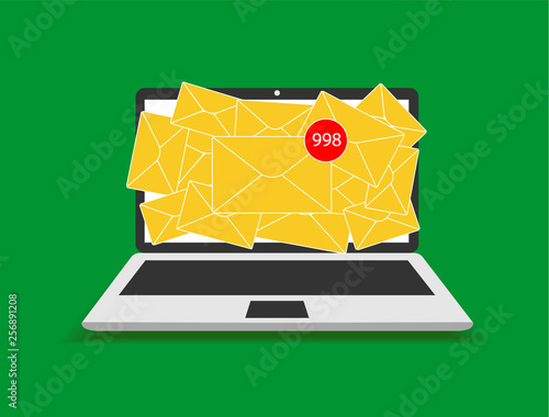 On the laptop screen appears spam, a lot of letters in the mail.