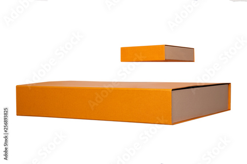 Gift box isolated. Close-up of two orange gift boxes or cardboard boxes isolated on a white background. Gift box template.