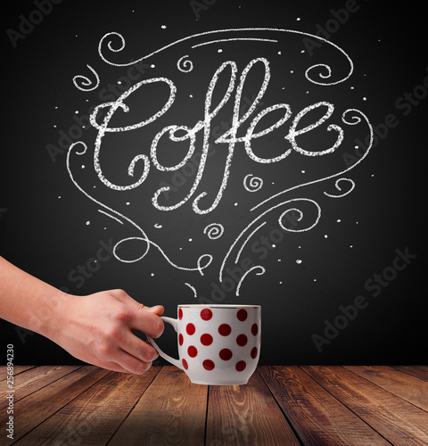 Steaming cup of coffee with white doodle line art and coffee inscription 