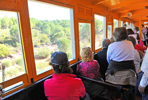 People inside the tourist train in a tour of the old mines of Rio Tinto, province of Huelva, Andalusia, Spain.