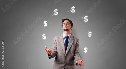 Young happy person juggle with dollar symbol   © ra2 studio