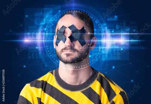 Facial recognition system. Young man on blue background