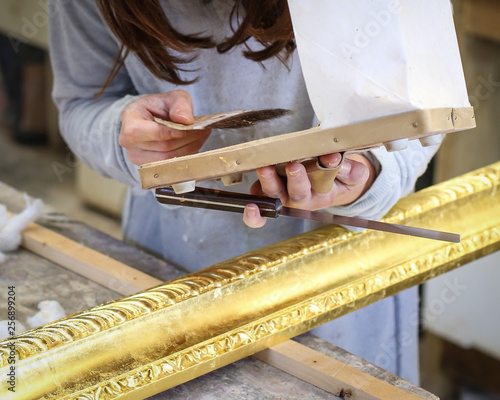 Gilder at work with tools