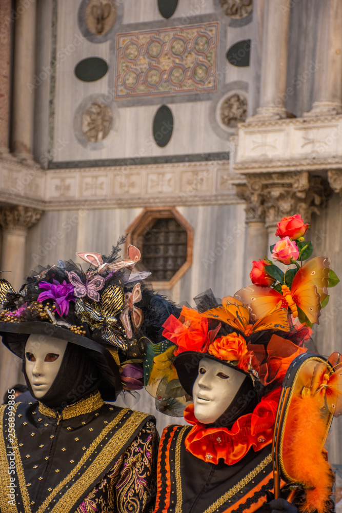 Italy, Venice, carnival, 2019, people with beautiful masks walk around Piazza San Marco, in the streets and canals of the city, posing for photographers and tourists, with colorful clothes. Italy, Venice, carnival, 2019, people with beautiful masks walk around Piazza San Marco, in the streets and canals of the city, posing for photographers and tourists, with colorful clothes.