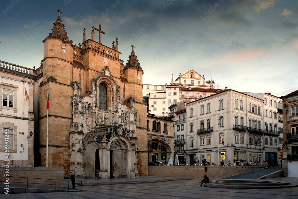Monastery and Church of Santa Cruz with a facade in the style of Manuelino in the city of Coimbra, Portugal, in the evening at sunset