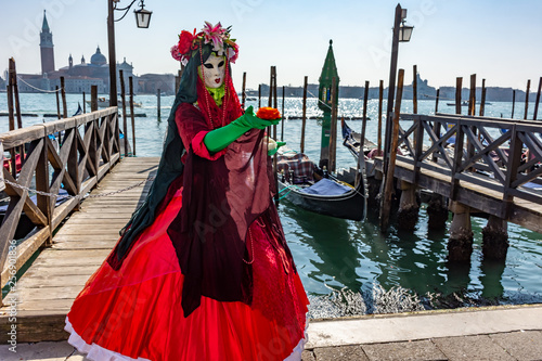 Italy, Venice, carnival, 2019, masked people roam the city, posing for photographers and tourists, with beautiful clothes. © benny