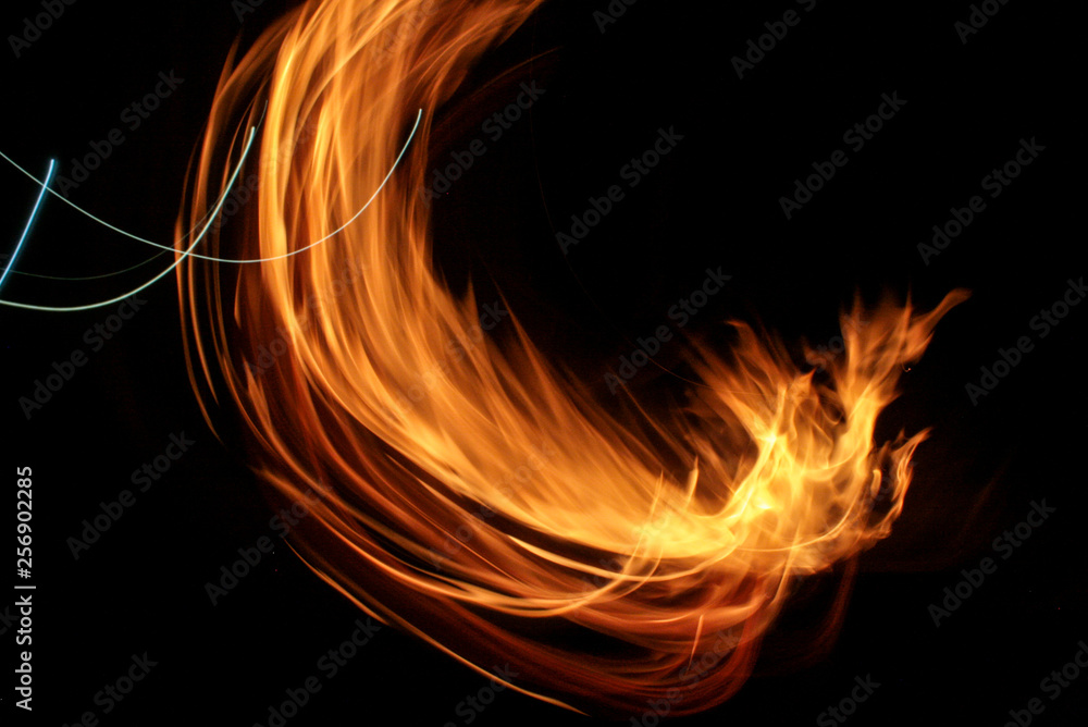 Fototapeta premium Fire with sparks on a black background. Flame. Bonfire Summer night