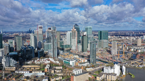 Aerial bird's eye panoramic photo taken by drone of iconic Canary Wharf skyscraper complex and business district, Isle of Dogs, London, United Kingdom © aerial-drone