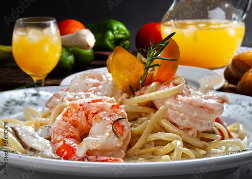 Pasta with large shrimp in restaurant on the beach
