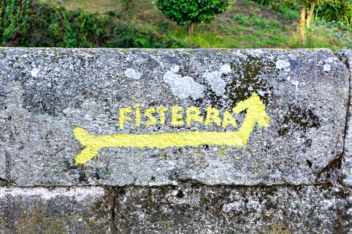 Sign and arrow of ancient pilgrim routes The Way of Saint James(El Camino de Santiago) to Fisterra. photo