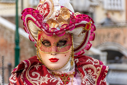 Italy, Venice, carnival 2019, typical masks, beautiful clothes, posing for photographers and tourists. © benny
