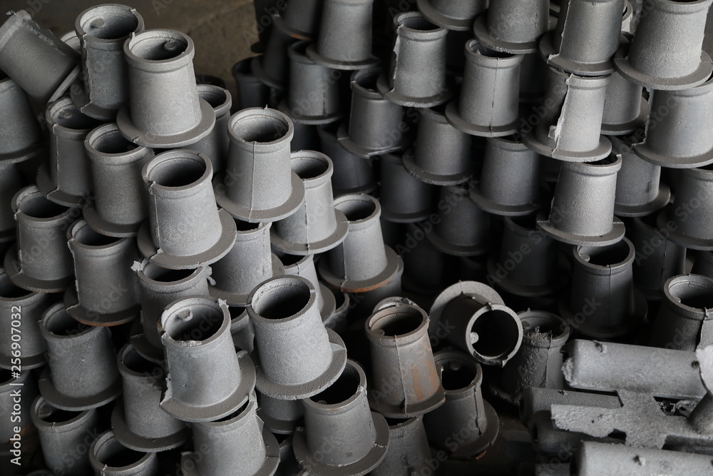 Stocks Of Unfinished Gray Hydrant Caps Piled Up In Sewerage Products Warehouse Close Up Stocks Of Unfinished Gray Hydrant Caps Piled Up In Sewerage Products Warehouse Close Up
