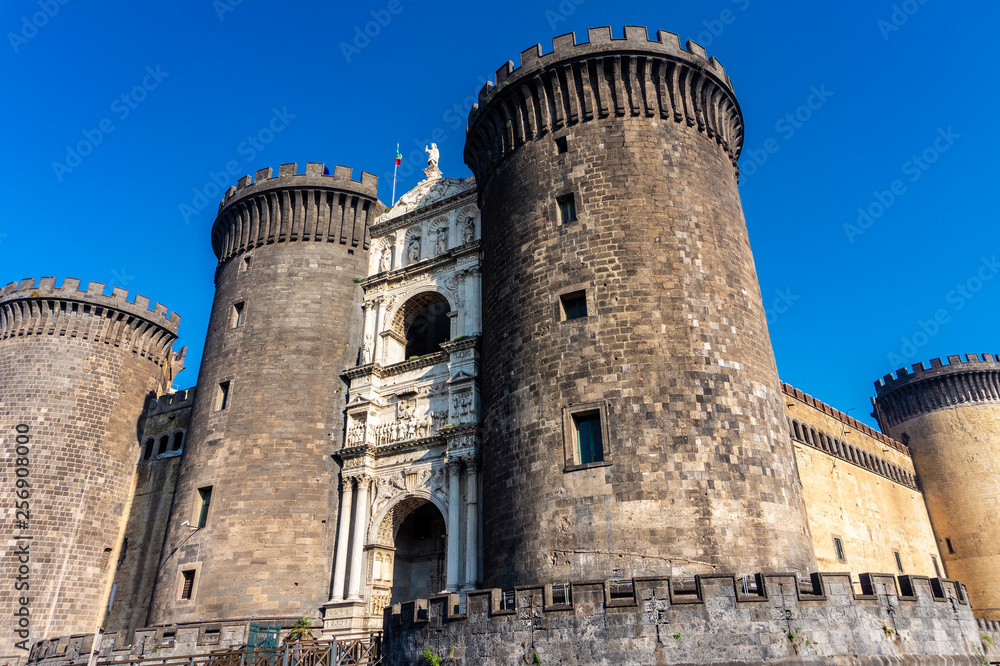 Medieval castle Maschio Angioino in a summer day in Naples