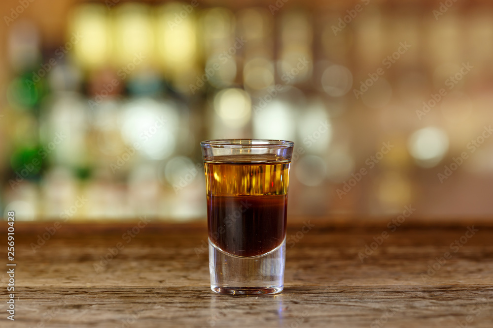 Cocktail shot with whiskey on the bar Cocktail shot with whiskey on the bar