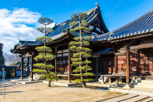 Honeiji Shrine in Kurashiki Japan with blue sky and trees