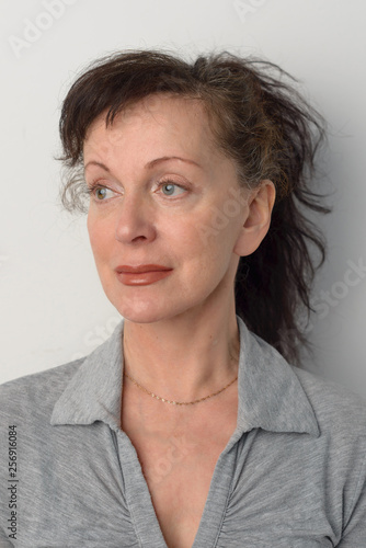 Portrait of beautiful adult woman on white background in photo Studio