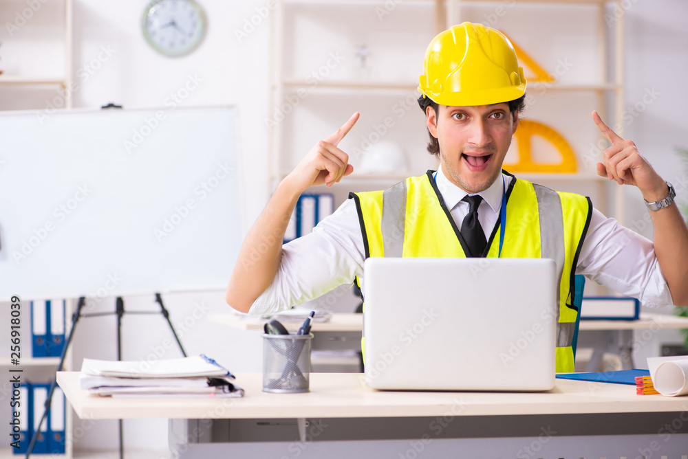 Male construction engineer working in the office Male construction engineer working in the office
