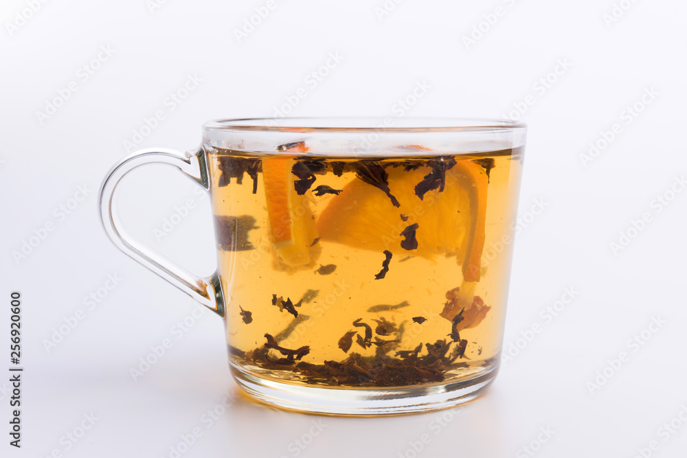 Glass cup of hot aromatic tea on white background Glass cup of hot aromatic tea on white background