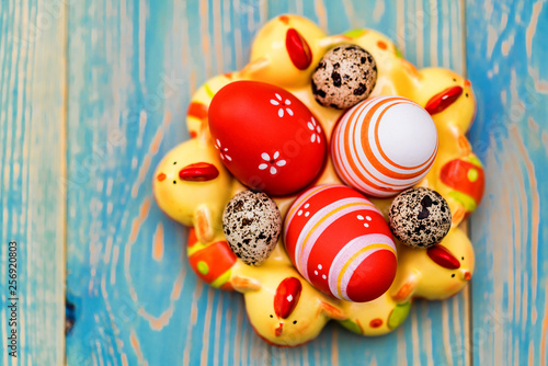 Several colorful Easter eggs in decorative tray
