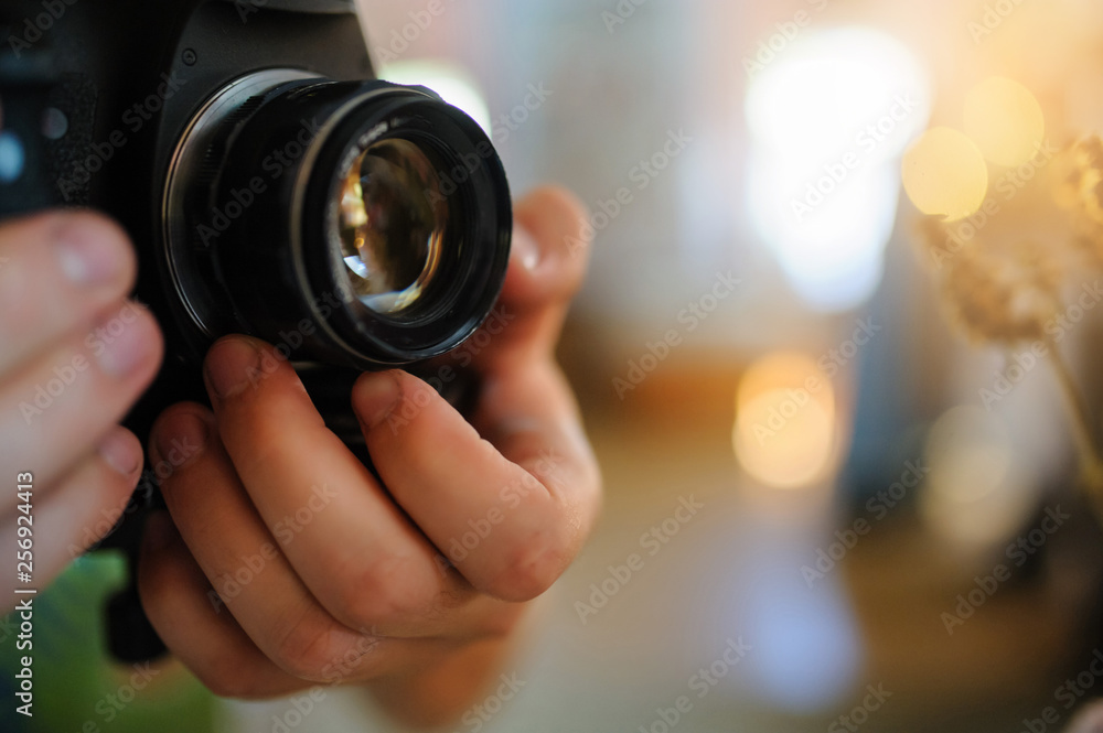 close up photo of man's hands on a photo camera close up photo of man's hands on a photo camera