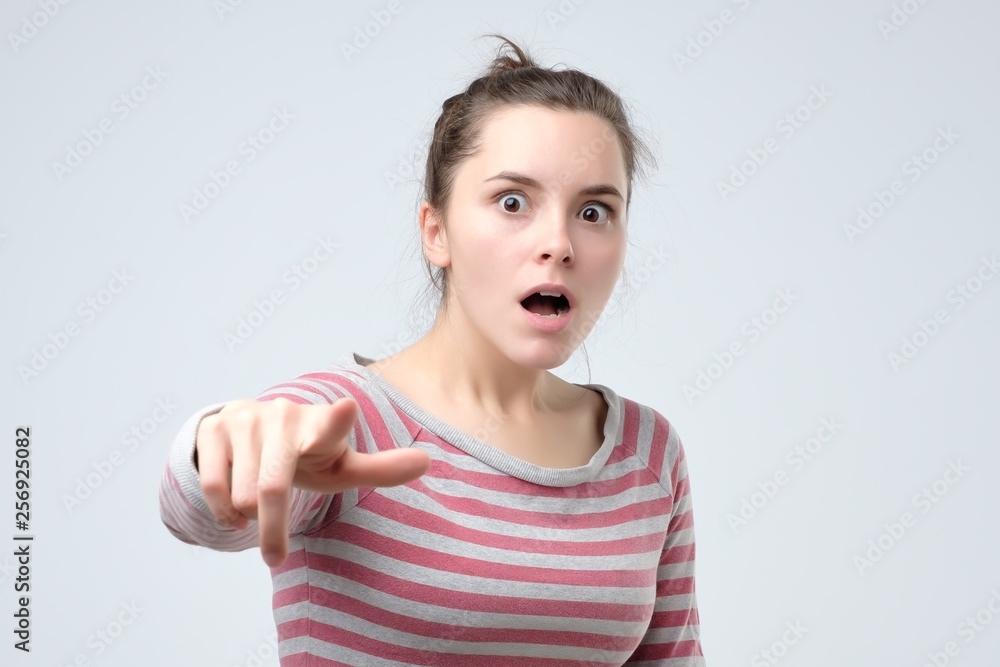angry woman points with fore finger, feels mad angry woman points with fore finger, feels mad