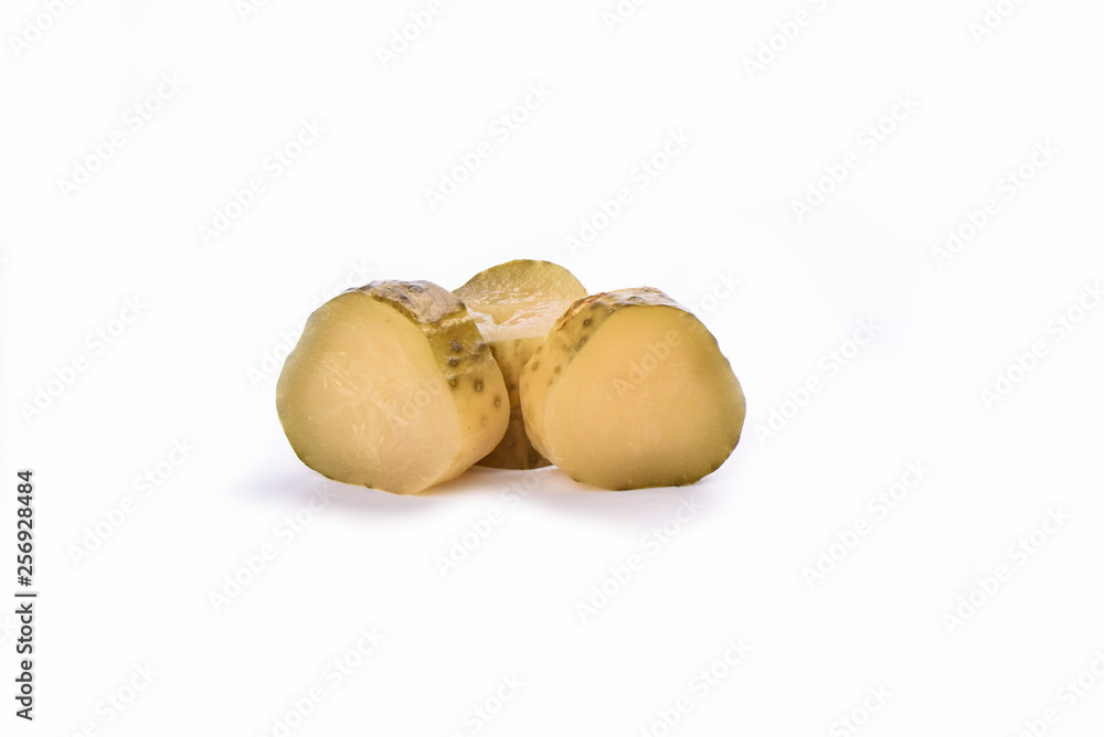 Pickled cucumber cut into slices isolated on a white background. Salting concept. Pickled cucumber cut into slices isolated on a white background. Salting concept.