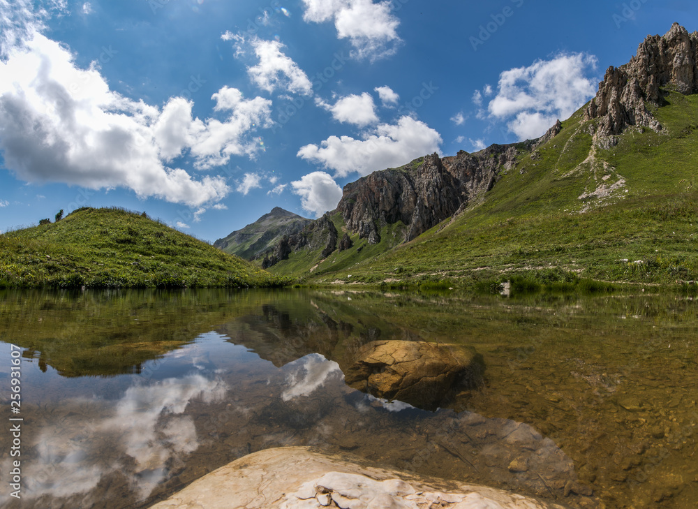The lake at the foot of the mountain at the noon, Russia, the Caucasus