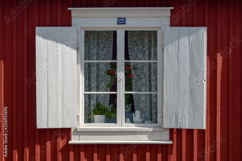 Window of a falu red house in Gammelstaden, Sweden photo