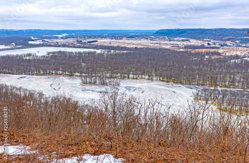 Frozen River in Winter from its Bluffs