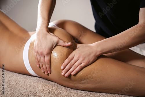 Woman legs. Body care. Beautiful woman getting anti cellulite leg oil massage treatment in spa salon. Skin care  fat burning  weight loss  wellness  lifestyle  relaxing procedure.