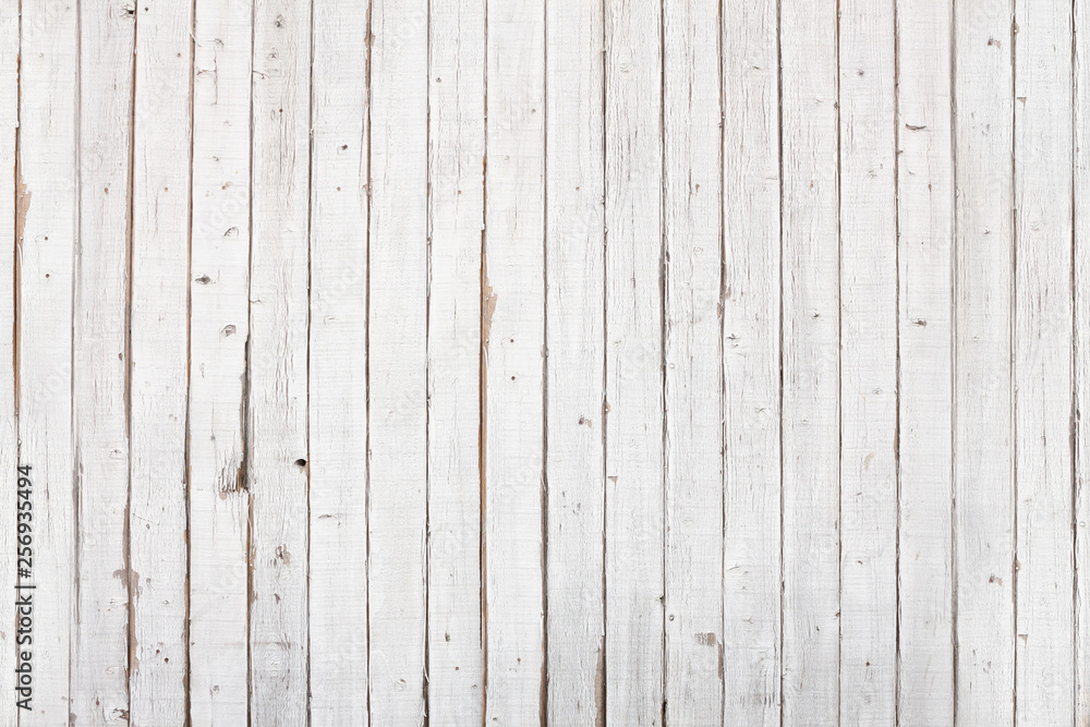 A grungy white painted wooden background A grungy white painted wooden background