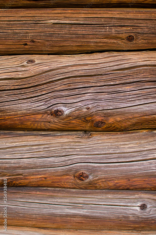 Naklejka premium Background from an old brown logs