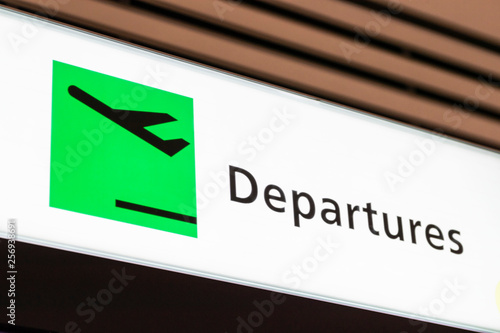 Departures signs hang on the ceiling