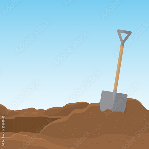 Shovel stuck in the soil isolated