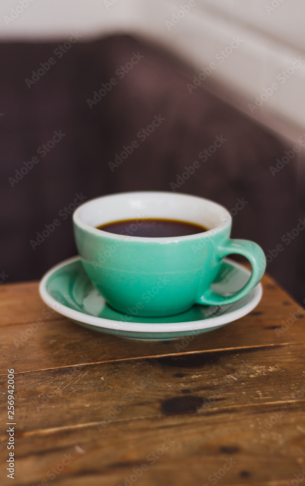Black coffee in blue cup on wooden background, filter coffee. Black coffee in blue cup on wooden background, filter coffee.