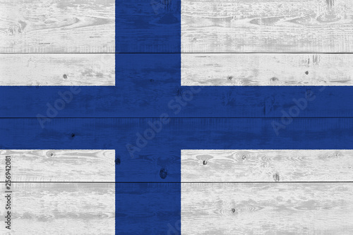 Finland flag painted on old wood plank