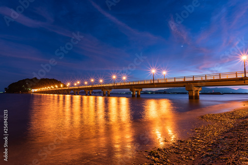 Light up of the bridge to the island at sunset. Aichi, Japan