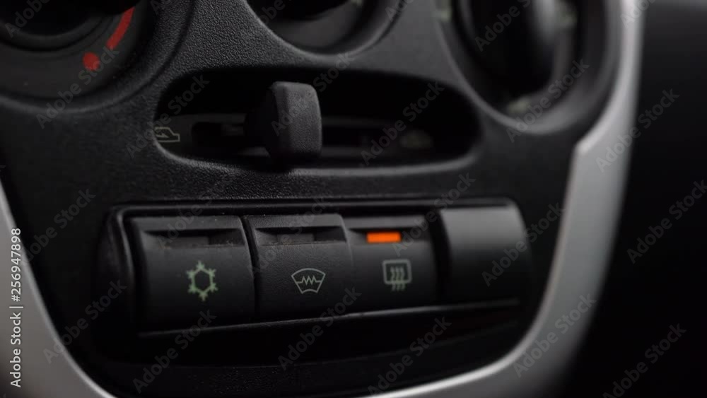 Interior of a car. Heated Windscreen Switch Button. winter car Interior of a car. Heated Windscreen Switch Button. winter car