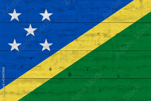 Solomon Islands flag painted on old wood plank