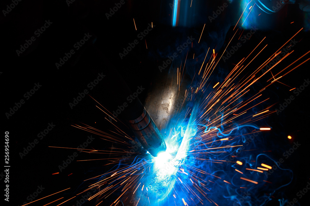 Arc welding. Welding of two metal plates in inert gases. MIG / MAG. A