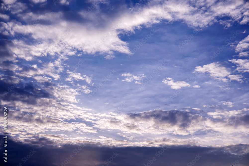 Background and texture of bright blue sky and cotton clouds with sun lights on afternoon summer. Background and texture of bright blue sky and cotton clouds with sun lights on afternoon summer.