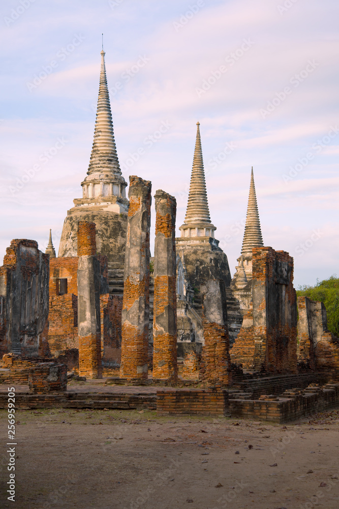 Fototapeta premium View of the ruins of the Buddhist temple of Wat Phra Sri Sanphet in the early morning. Ayutthaya, Thailand