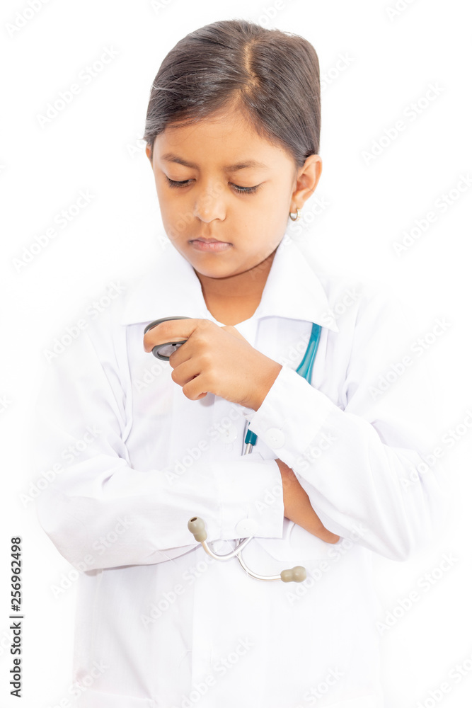 Cute little girl doctor, with stethoscope and white medical uniform Cute little girl doctor, with stethoscope and white medical uniform